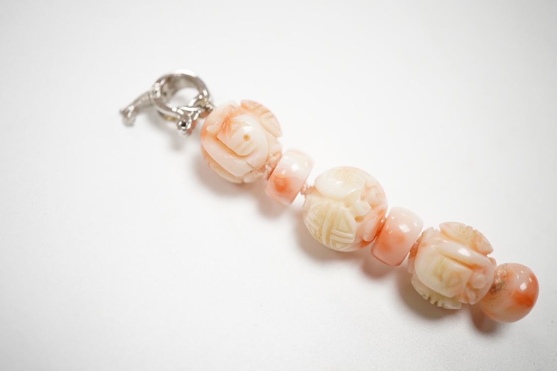 A 20th century adventurine quartz and coral bead set necklace, with a 925 clasp, 80cm, together with a similar carved coral line drop pendant, with a 750 white metal clasp.